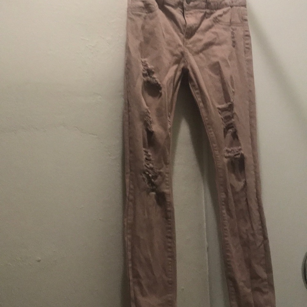 Blush pink ripped jeans
